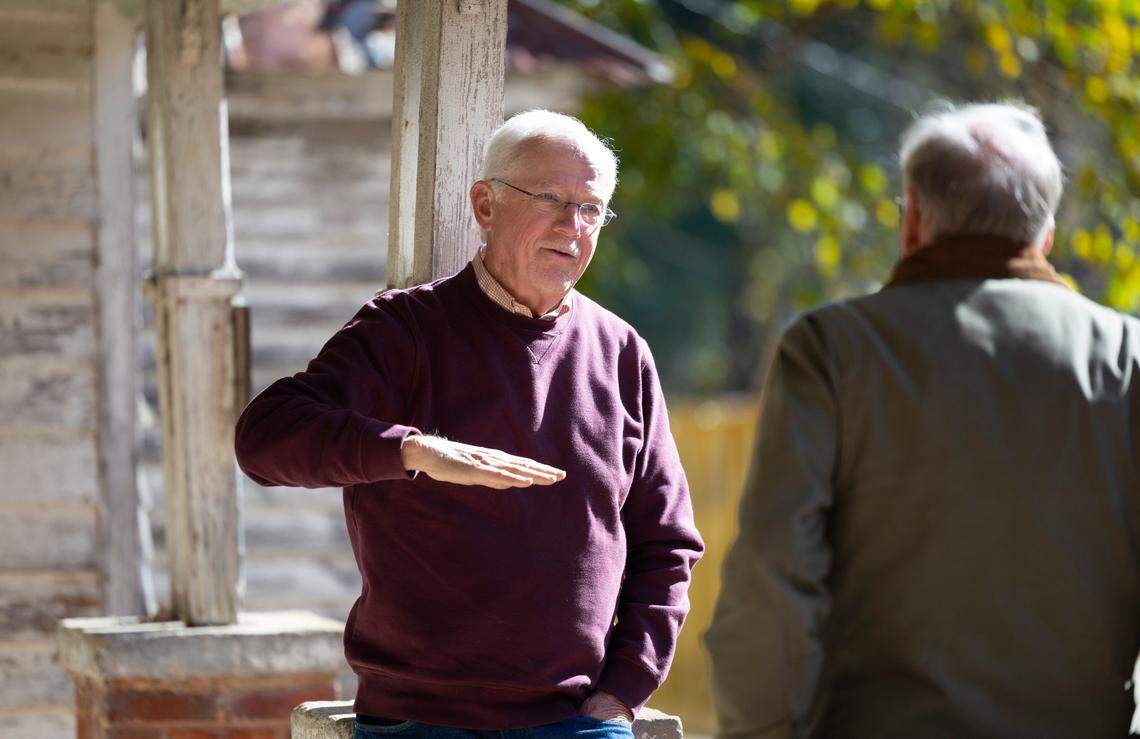 Myrick Howard, left, talks with Richard Hunter outside the Thomas Reynolds house in Warrenton, N.C. on Monday, Nov. 13, 2023. The home, which dates to the early 19th century, is also known as Reynolds Tavern and is being offered for sale by Preservation North Carolina.