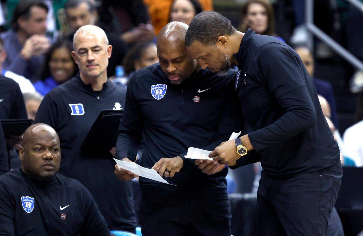 Duke assistant coach Emanuel Dildy talks to associate head coach Chris Carrawell during the first half of Duke’s game against Arizona in the Sweet 16 round of the 2025 Men’s NCAA Basketball Championship at the Prudential Center in Newark, N.J., Thursday, March 27, 2025.