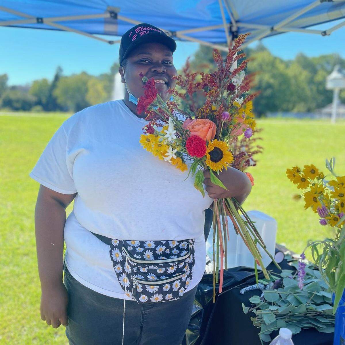 Adanna Omeni is the owner and founder of Raleigh/Durham’s 1 Blossom 2 Bloom Floral Design.