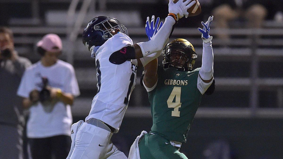 Heritage’s Tavares Carter (13) makes the catch against Cardinal Gibbons’ Tristen Beasley (4) during the first quarter. The Heritage Huskies and the Cardinal Gibbons Crusaders met in a NCHSAA 4A playoff game in Raleigh, N.C. on November 12, 2021
