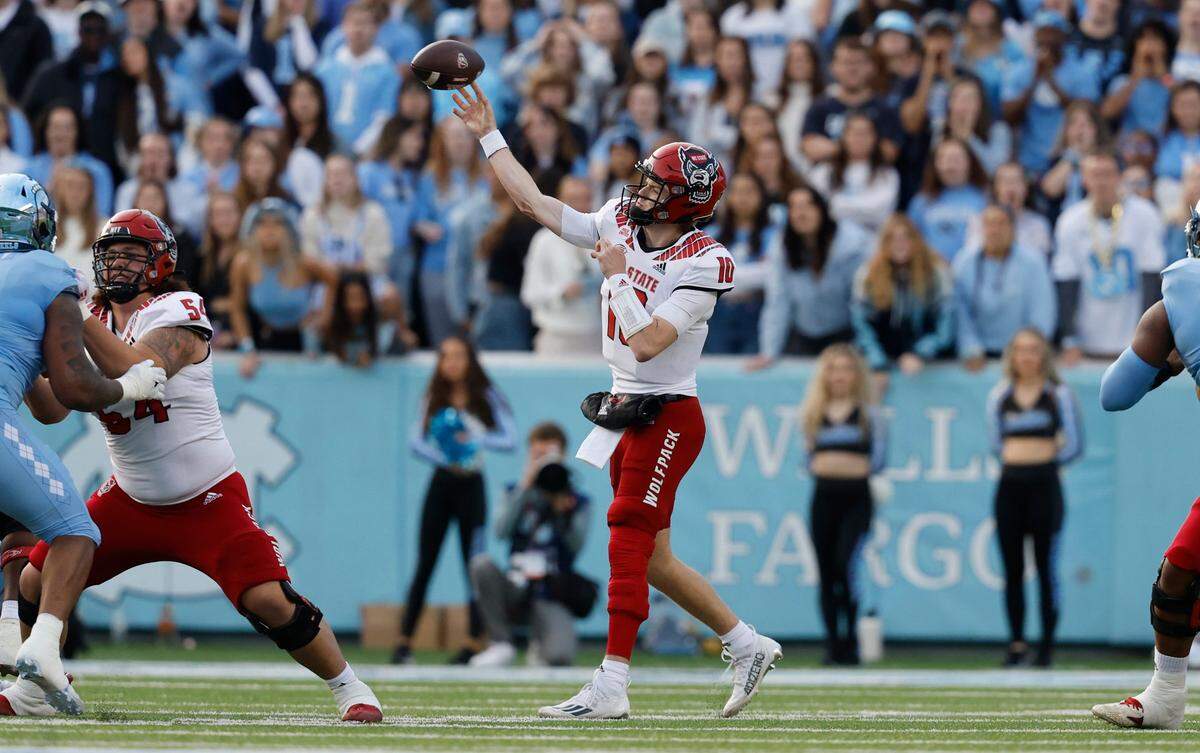 N.C. State quarterback Ben Finley (10) passes during the first half of N.C. State’s game against UNC at Kenan Stadium in Chapel Hill, N.C., Friday, Nov. 25, 2022.
