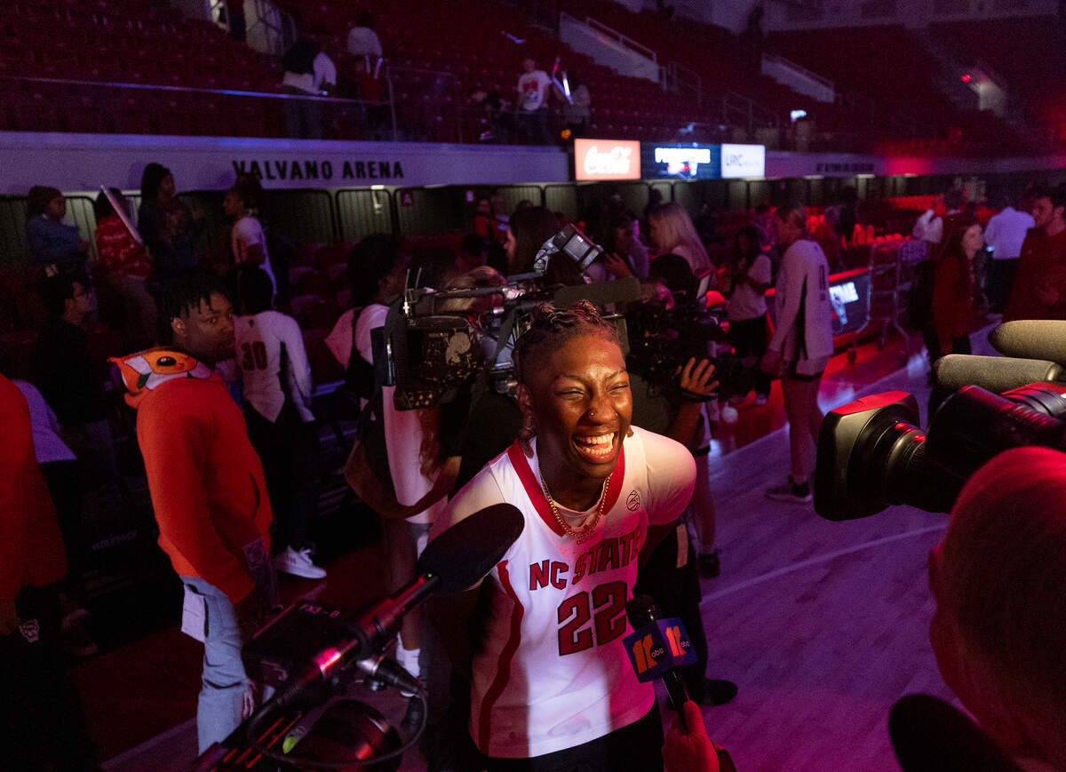 N.C. State’s Saniya Rivers smiles while talking with media after making a dunk in a dunk contest at the “Primetime with the Pack” preseason event on Thursday, Oct. 26, 2023, at Reynolds Coliseum in Raleigh, N.C.