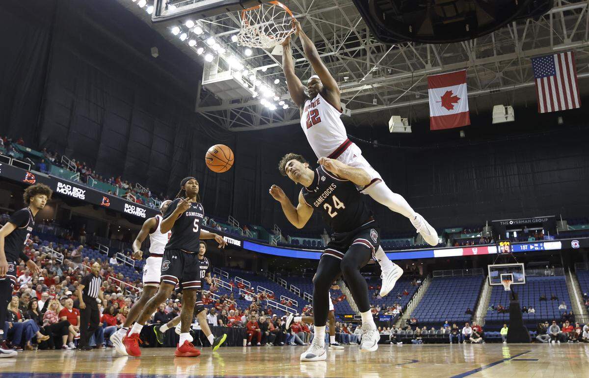 N.C. State's Ven-Allen Lubin (22) slams in two over South Carolina's Nordin Kapic (24) during N.C. State’s 88-86 exhibition victory over South Carolina at the First Horizon Coliseum in Greensboro, N.C., Sunday Oct. 26, 2025.