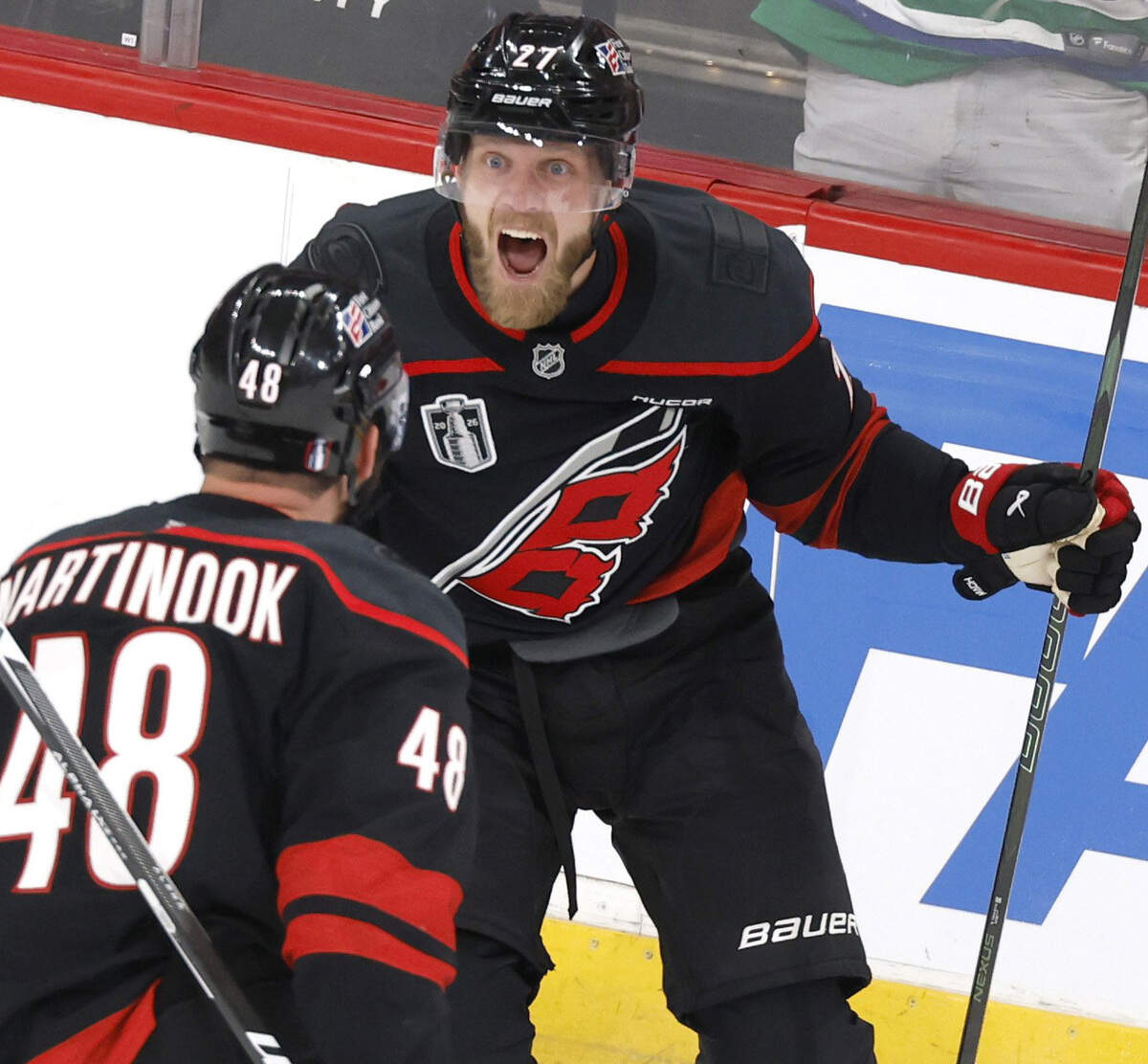 Carolina's Nikolaj Ehlers (27) celebrates with Jordan Martinook (48) after Ehlers scored in the first period of the Hurricanes’ game against the Golden Knights in the first game of the Stanley Cup Final at the Lenovo Center in Raleigh, N.C., Tuesday, June 2, 2026.