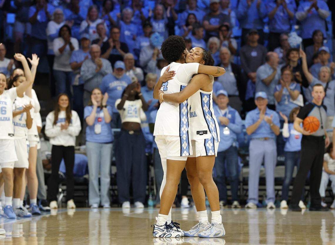 North Carolina senior Indya Nivar, right, gets a hug from teammate Laila Hull before checking out of the game late in the second half of the Tar Heels’ 74-69 win over Duke on Sunday, March 1, 2026, at Carmichael Arena in Chapel Hill, N.C.