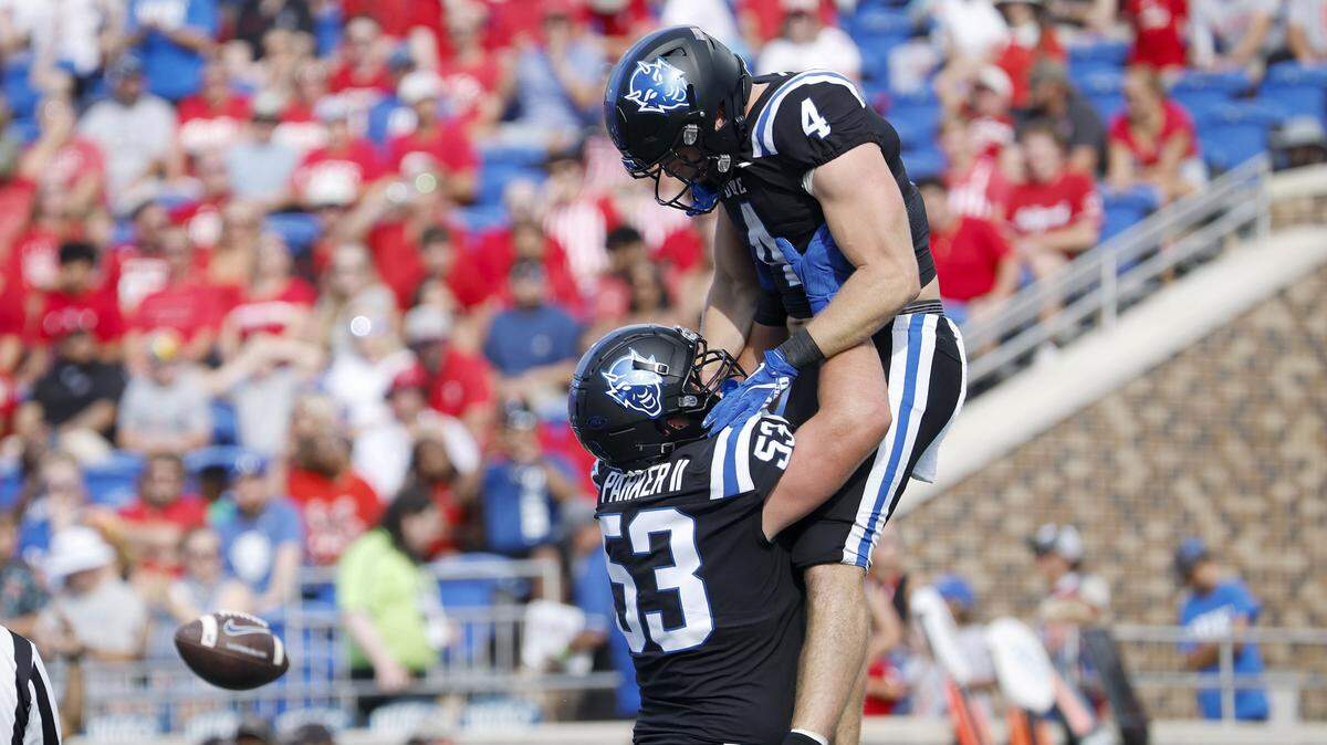 Duke’s Brian Parker II and Anderson Castle celebrate following a touchdown during the first half of the Blue Devils’ game against N.C. State on Saturday, Sept. 20, 2025, at Wallace Wade Stadium in Durham, N.C.