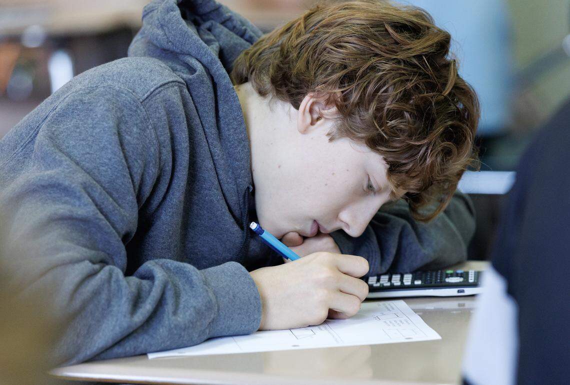 Millbrook High School freshman Lucas Ward works on an assignment during a math class on Tuesday, Sept. 2, 2025, in Raleigh, N.C.