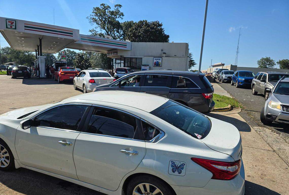 Vehicles line up to get gas at a 7 Eleven in Shelby on Saturday, Sept. 28, 2024