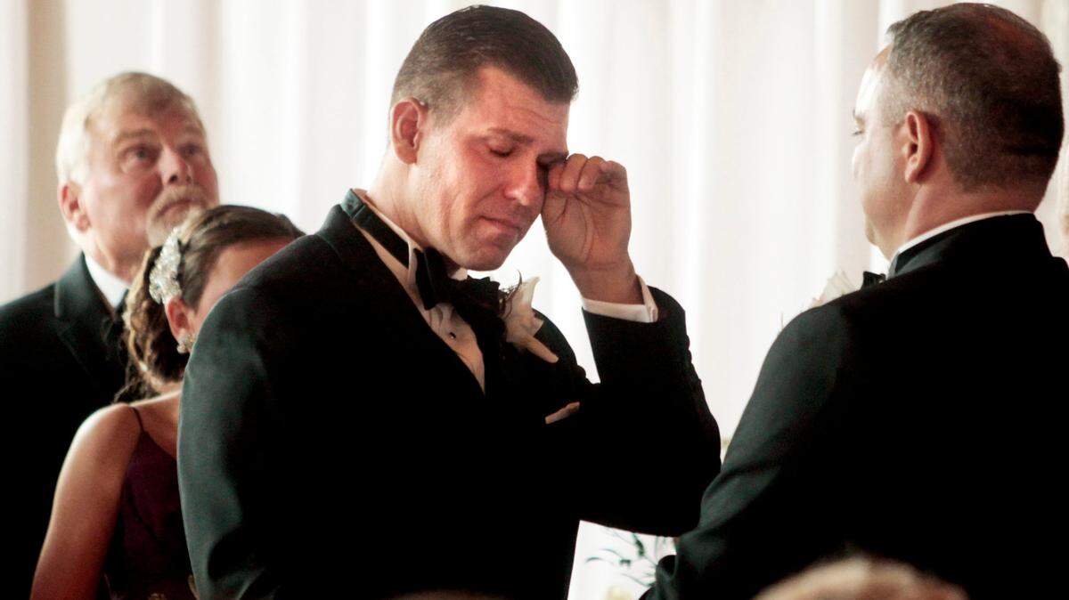 Fighting back tears of joy, Chad Biggs, left, prepares to read his vows to his husband Chris Creech, right. After almost a year of planning, the couple celebrated with friends at their formal wedding at Melrose in Raleigh, N.C. on Saturday, September 26, 2015. They were the first gay couple to marry in N.C. on October 10, 2014 at the Wake County Courthouse after U.S. District Judge Max Cogburn ruling that made same-sex marriages legal in North Carolina.