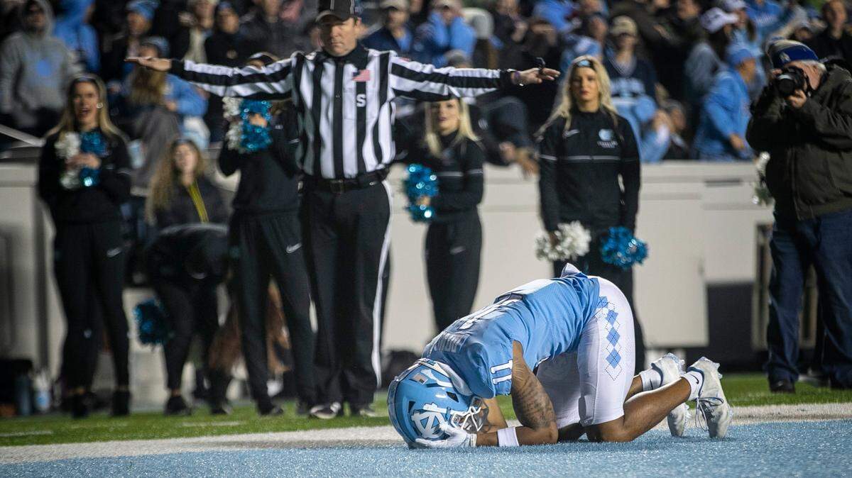 North Carolina’s Josh Downs (11) reacts after dropping a pass from quarterback Drake Maye on fourth down with 4:10 to play in the fourth quarter on Saturday, November 19, 2022 at Kenan Stadium in Chapel Hill, N.C. The Tar Heels fell to the Yellowjackets 21-17.