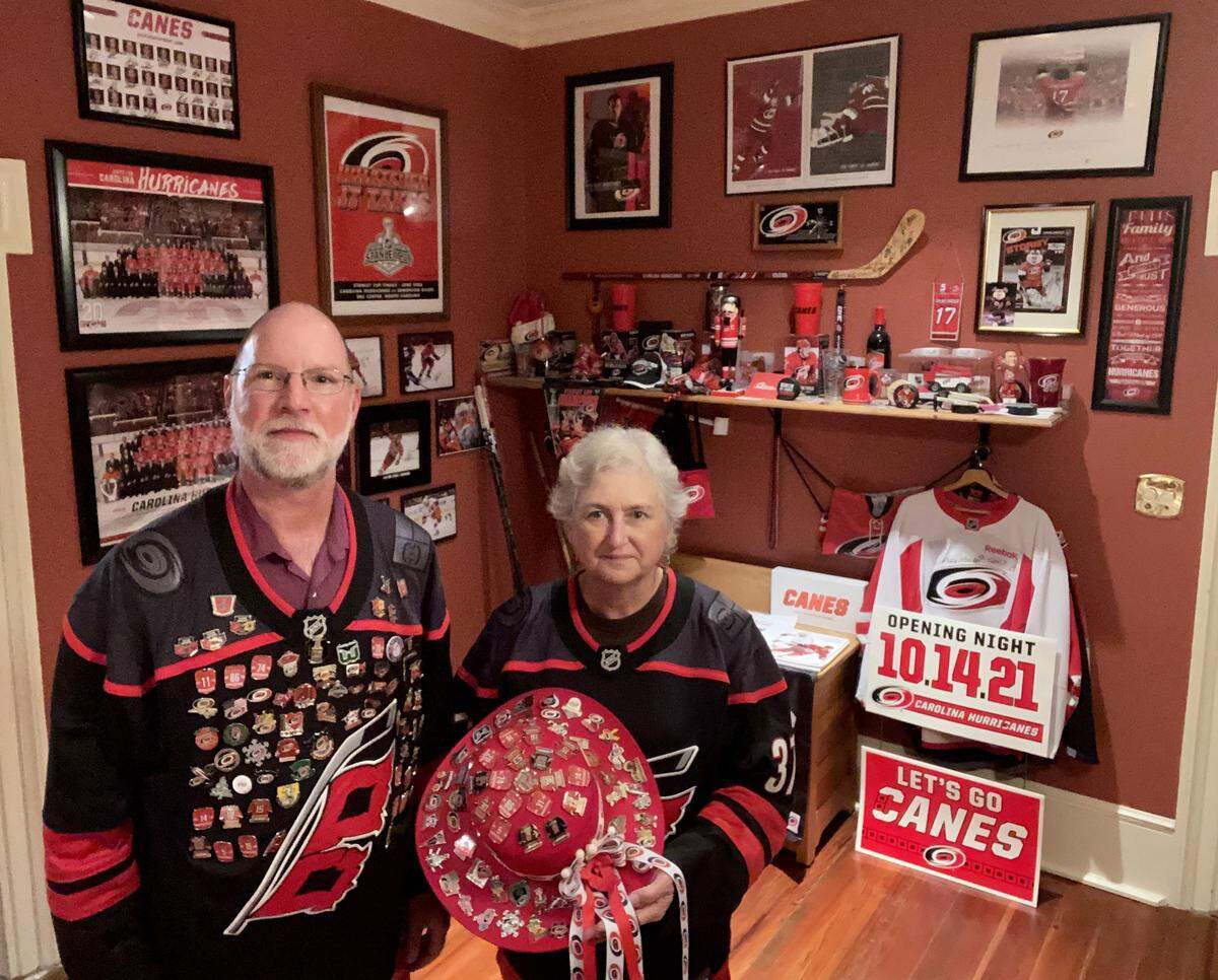 Dave and Bonnie Pulver with their Carolina Hurricanes collection of memorabilia at their home in Ayden, N.C