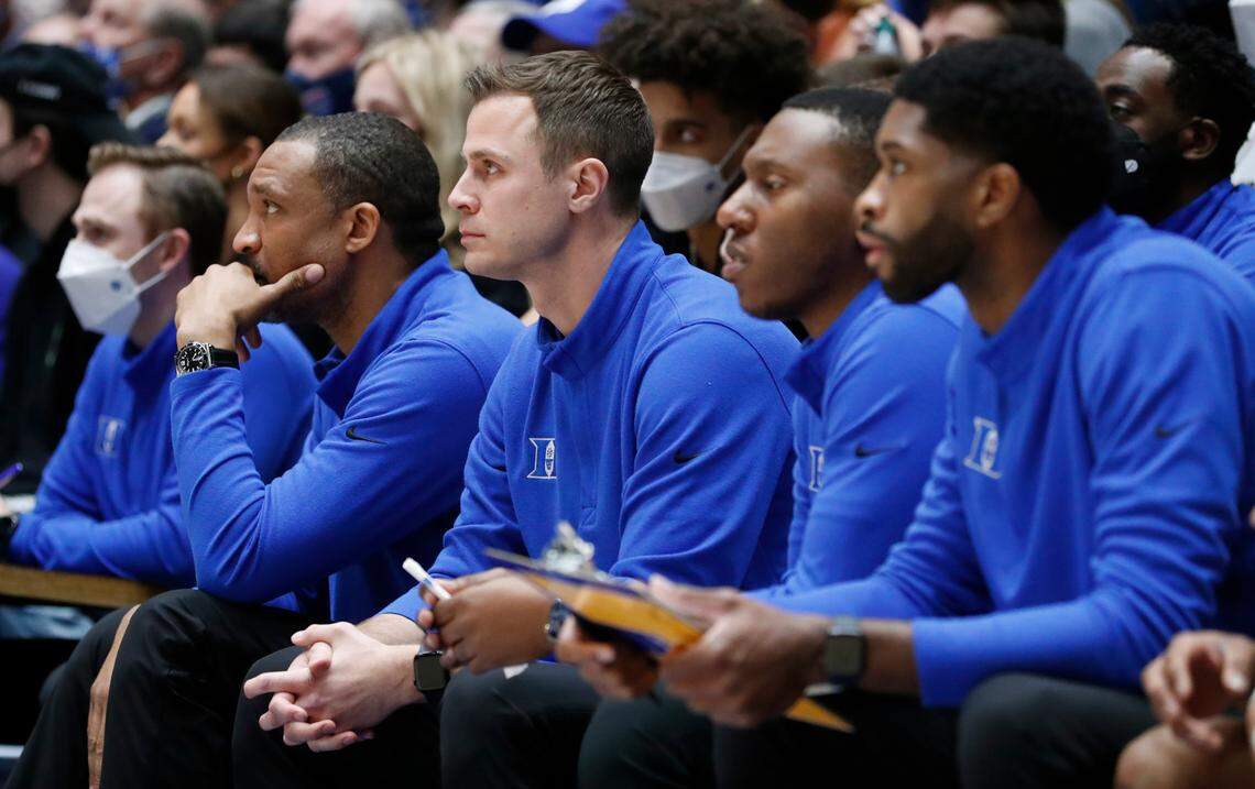 From left associate head coach Chris Carrawell, associate head coach Jon Scheyer, assistant head coach Nolan Smith and director of player development Amile Jefferson watch during the second half of Duke’s 76-74 victory over Wake Forest at Cameron Indoor Stadium in Durham, N.C., Tuesday, Feb. 15, 2022.