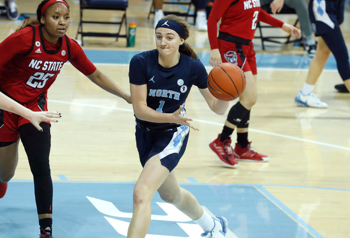 North Carolina’s Alyssa Ustby (1) passes the ball during the second half of UNC’s 76-69 victory over N.C. State at Carmichael Arena in Chapel Hill, N.C., Sunday, February 7, 2021.