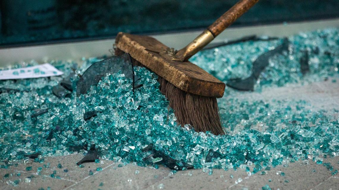 Black pastors say the shattered glass after protests reflects a broken, unjust system