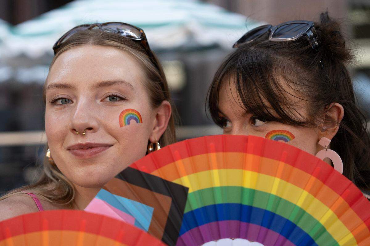 Dylan Gentner and Izzy Meyler pose for a portrait during the Out! Raleigh Pride festival in downtown Raleigh, Saturday, June 21, 2025.