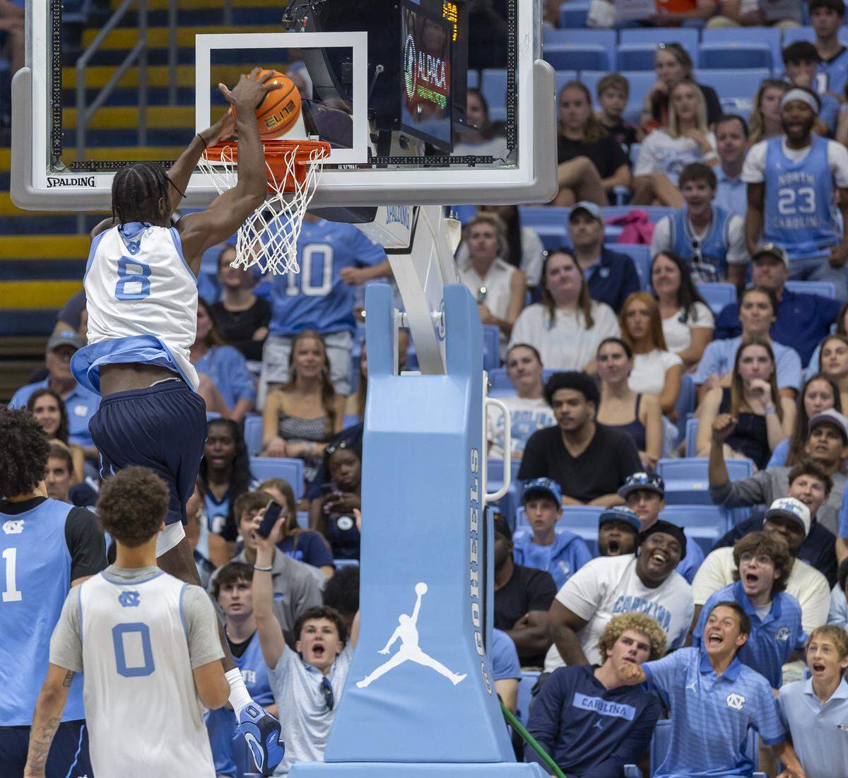 Much to the delight of fans, North Carolina forward Caleb Wilson (8) soars above the rim for a dunk, however the ball rimmed out, during the Blue-White scrimmage on Saturday, October 4, 2025 at the Smith Center in Chapel Hill, N.C.