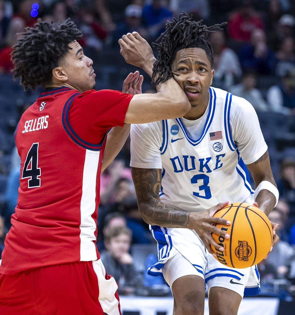 Duke forward Isaiah Evans (3) takes an elbow from St. John’s guard Oziyah Sellers (4) in the first half during the Sweet Sixteen of the NCAA Tournament on Friday, March 27, 2026, at Capital One Arena in Washington, D.C.