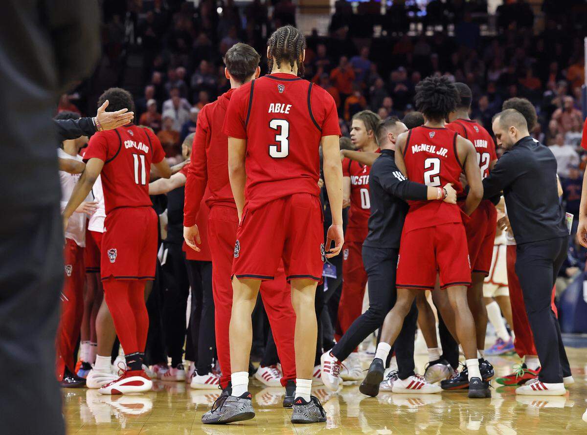N.C. State's Matt Able watches as team personnel separate players during a skirmish in the the second half of the Wolfpack’s 90-61 loss to Virginia on Thursday, Feb. 24, 2026, at John Paul Jones Arena in Charlottesville, Va.