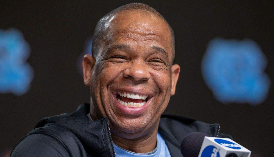 North Carolina coach Hubert Davis flashes a broad smile during the Tar Heels’ media availability ahead of their national championship game against Kansas on Sunday, April 3, 2022 at Caesars Superdome in New Orleans, La.
