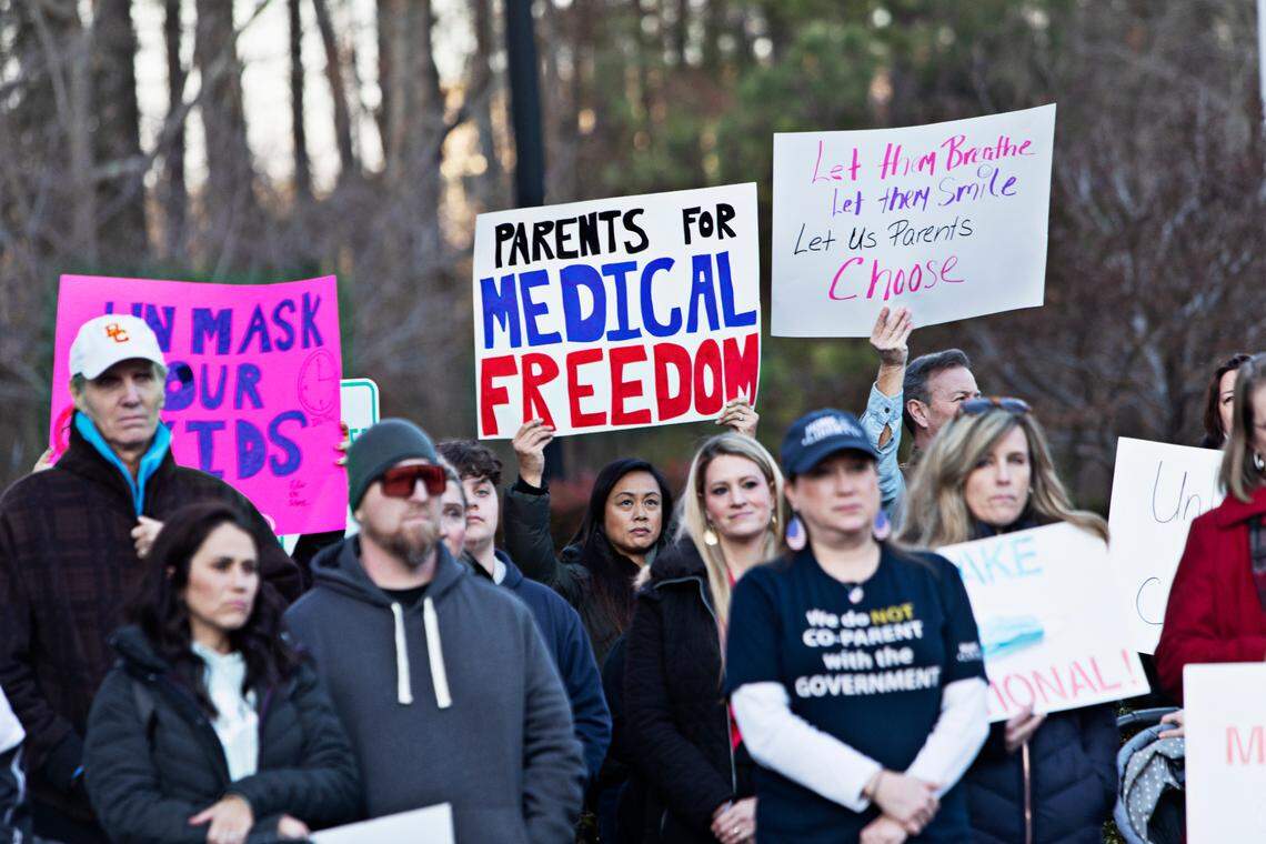 A crowd of around 100 people rallied outside Tuesday’s Wake County school board meeting in Cary Feb. 15, 2022, demanding that the district immediately stop mandating that students wear masks. Event participants want the school board to vote Tuesday or to call a special meeting by next week to vote on making masks optional.