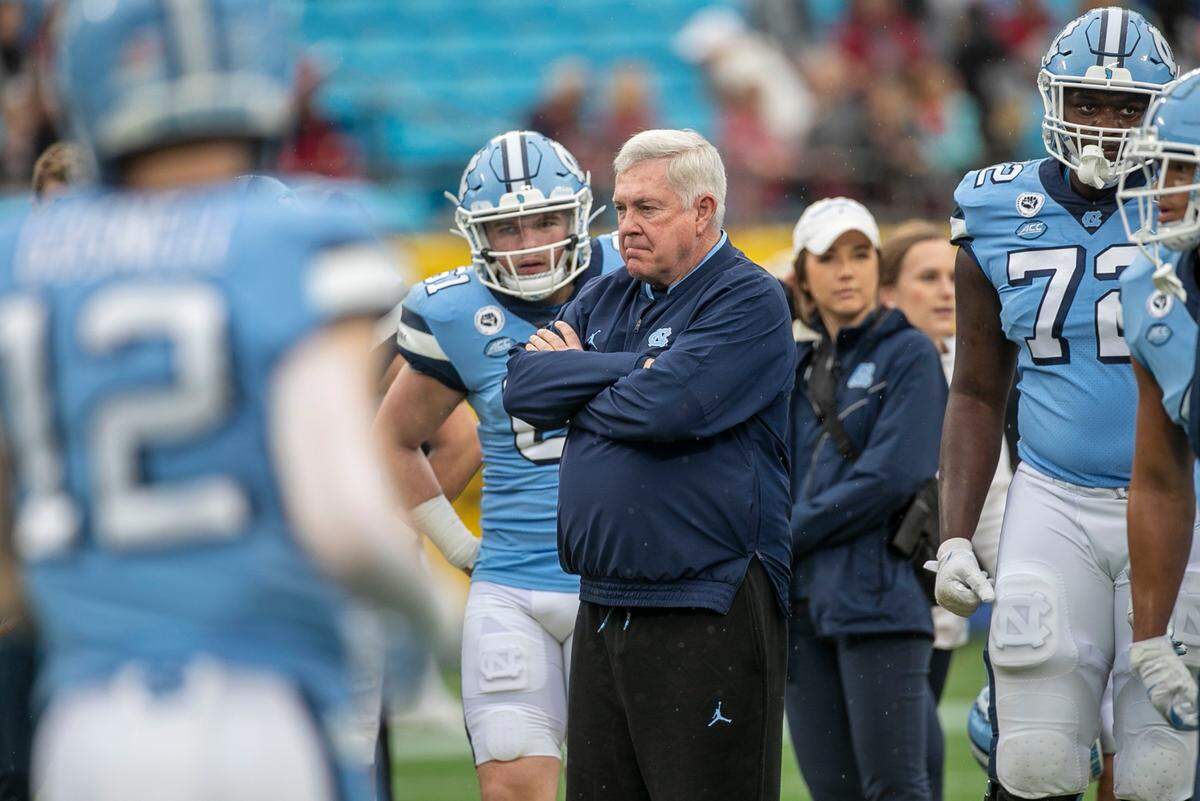 North Carolina coach Mack Brown watches his team warm up prior to their game against South Carolina in the Duke’s Mayo Bowl on Thursday, December 30, 2021 at Bank of America Stadium in Charlotte, N.C.