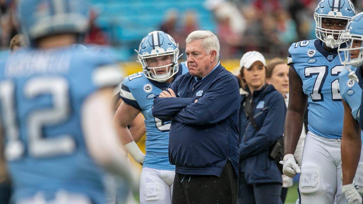 North Carolina coach Mack Brown watches his team warm up prior to their game against South Carolina in the Duke’s Mayo Bowl on Thursday, December 30, 2021 at Bank of America Stadium in Charlotte, N.C.
