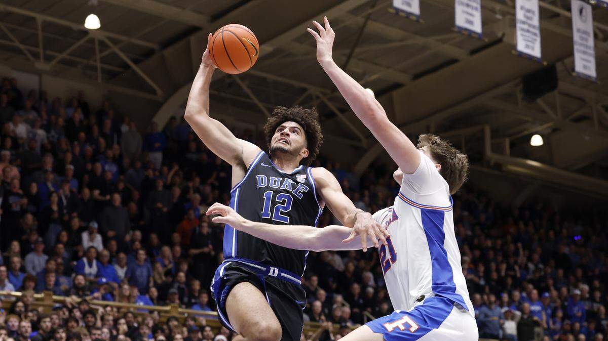 Duke’s Cameron Boozer drives to the basket past Florida's Alex Condon during the second half of the Blue Devils’ 67-66 win in the ACC/SEC Challenge on Tuesday, Dec. 2, 2025 at Cameron Indoor Stadium in Durham, N.C.
