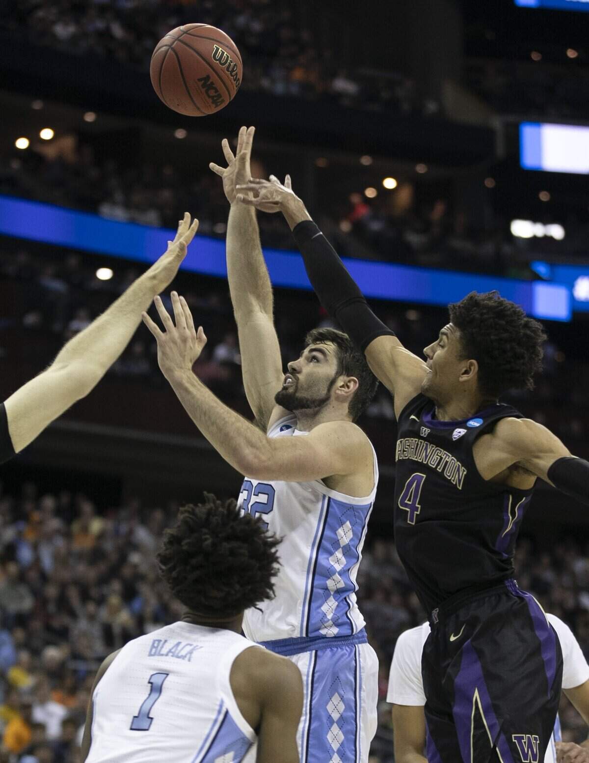North Carolina’s Luke Maye (32) puts up a shot over Washington’s Matisse Thybulle (4) during the first half in the second round of the NCAA Tournament on Sunday, March 24, 2019 at Nationwide Arena in Columbus, Ohio.