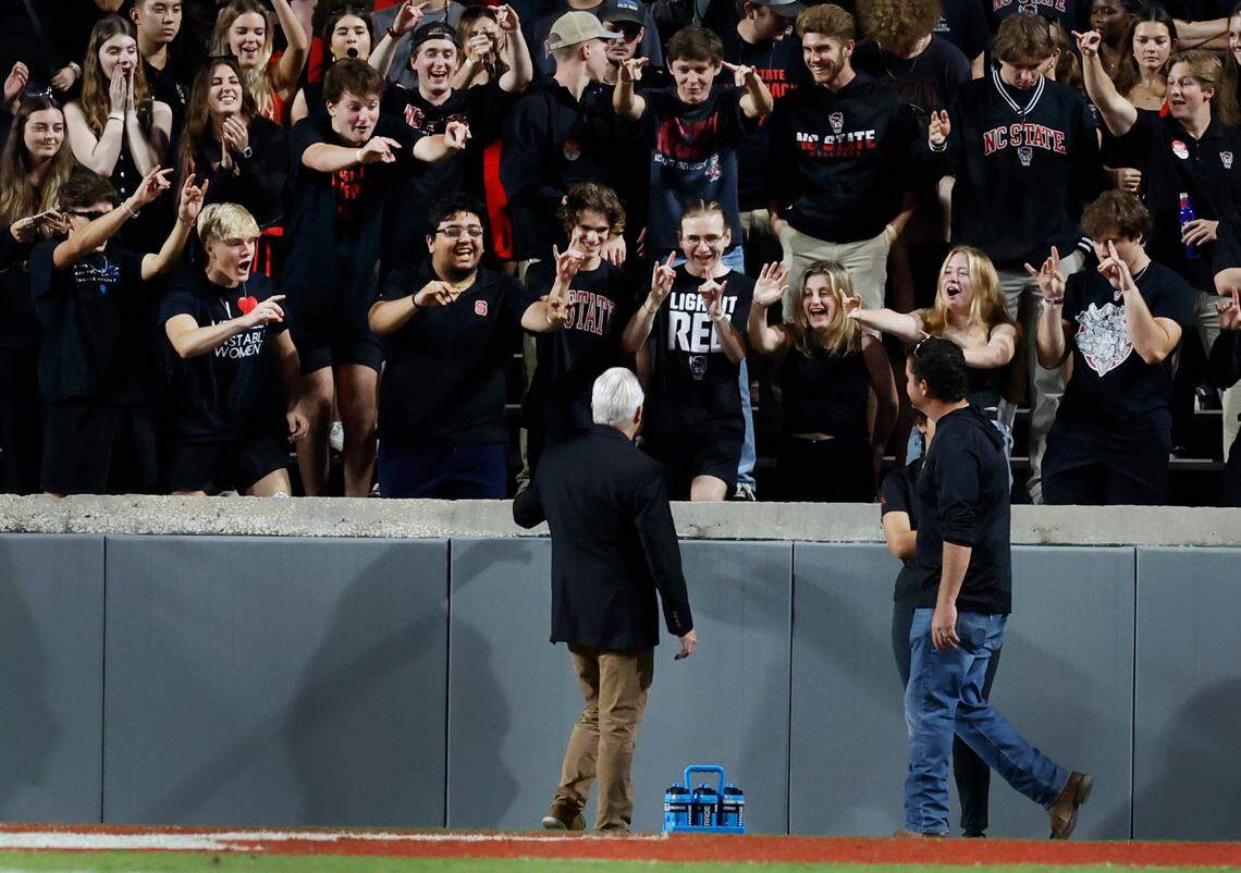 N.C. State Chancellor Randy Woodson talks with fans during the Wolfpack’s game against Louisville at Carter-Finley Stadium in Raleigh, N.C., Friday, Sept. 29, 2023.