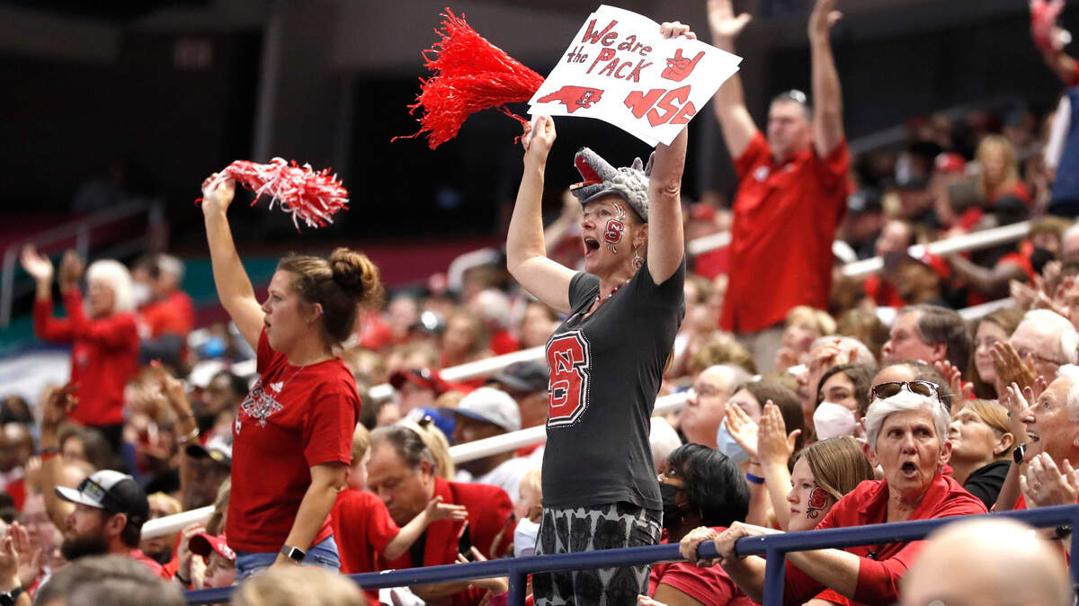 Fans cheer on the Wolfpack during the second half of N.C. State’s 60-47 victory over Miami to win the ACC women’s basketball tournament in Greensboro, N.C., Sunday, March 6, 2022.