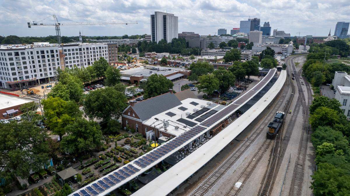 An aerial view from July 2022 of Logan’s Garden Shop at Seaboard Station in Raleigh with the CSX railroad line in the foreground. The N.C. Department of Transportation is buying the CSX line from Raleigh to Ridgeway and also hopes to buy 7 miles of property along the corridor from GoTriangle, allowing the transit agency to pay back the federal government.