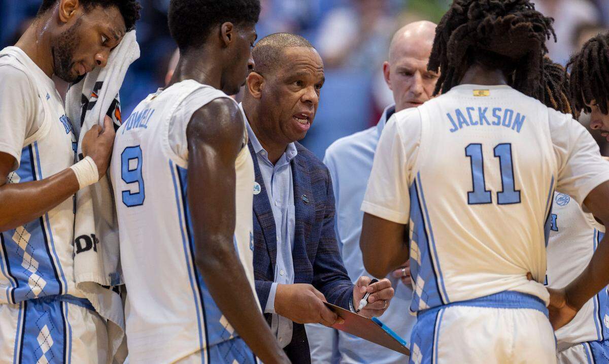 North Carolina coach Hubert Davis diagrams a play with his players late in the second half against Pitt on Saturday, February 8, 2025 at the Smith Center in Chapel Hill, N.C