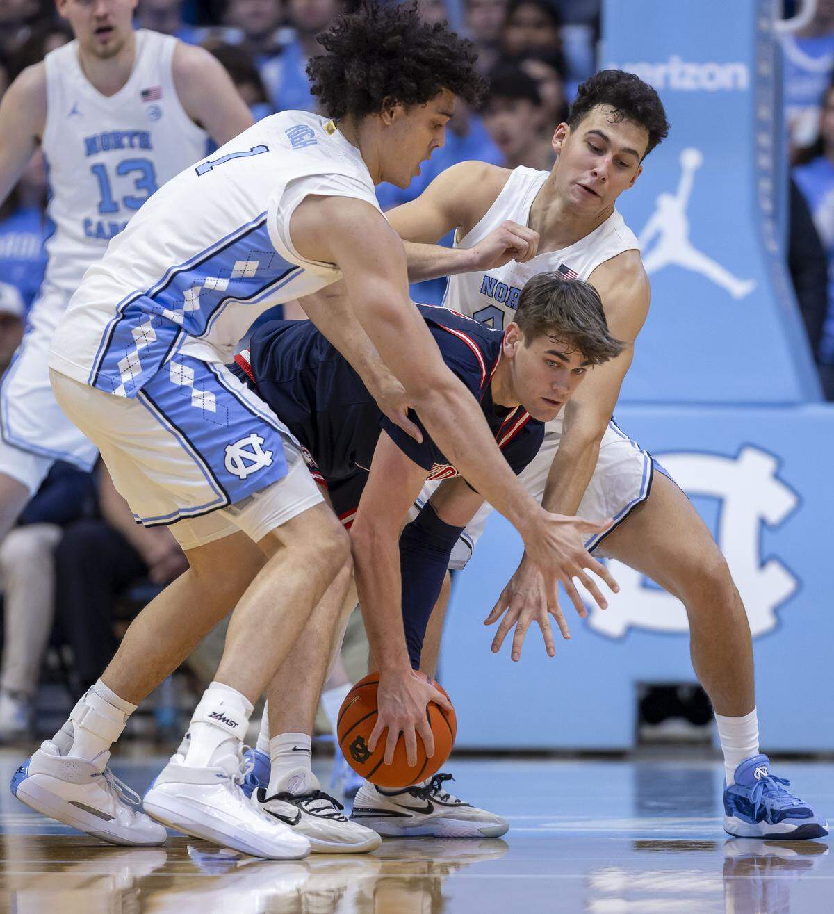 North Carolina forward Zayden High (1) and guard Luka Bogavac (44) trap Radford guard Brennan Rigsby Jr. (4) in the first half on Tuesday, November 11, 2025 at the Smith Center in Chapel Hill, N.C