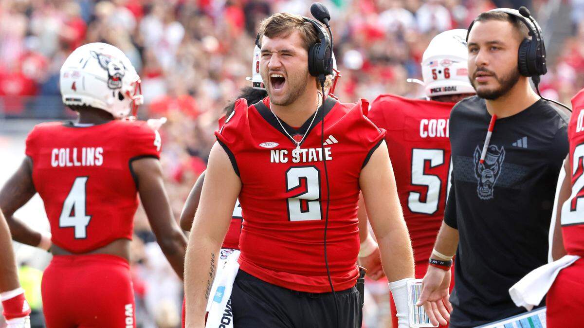 N.C. State quarterback Grayson McCall (2) celebrates after Hollywood Smothers scored a touchdown during the first half of N.C. State’s game against Stanford at Carter-Finley Stadium in Raleigh, N.C., Saturday, Nov. 2, 2024.