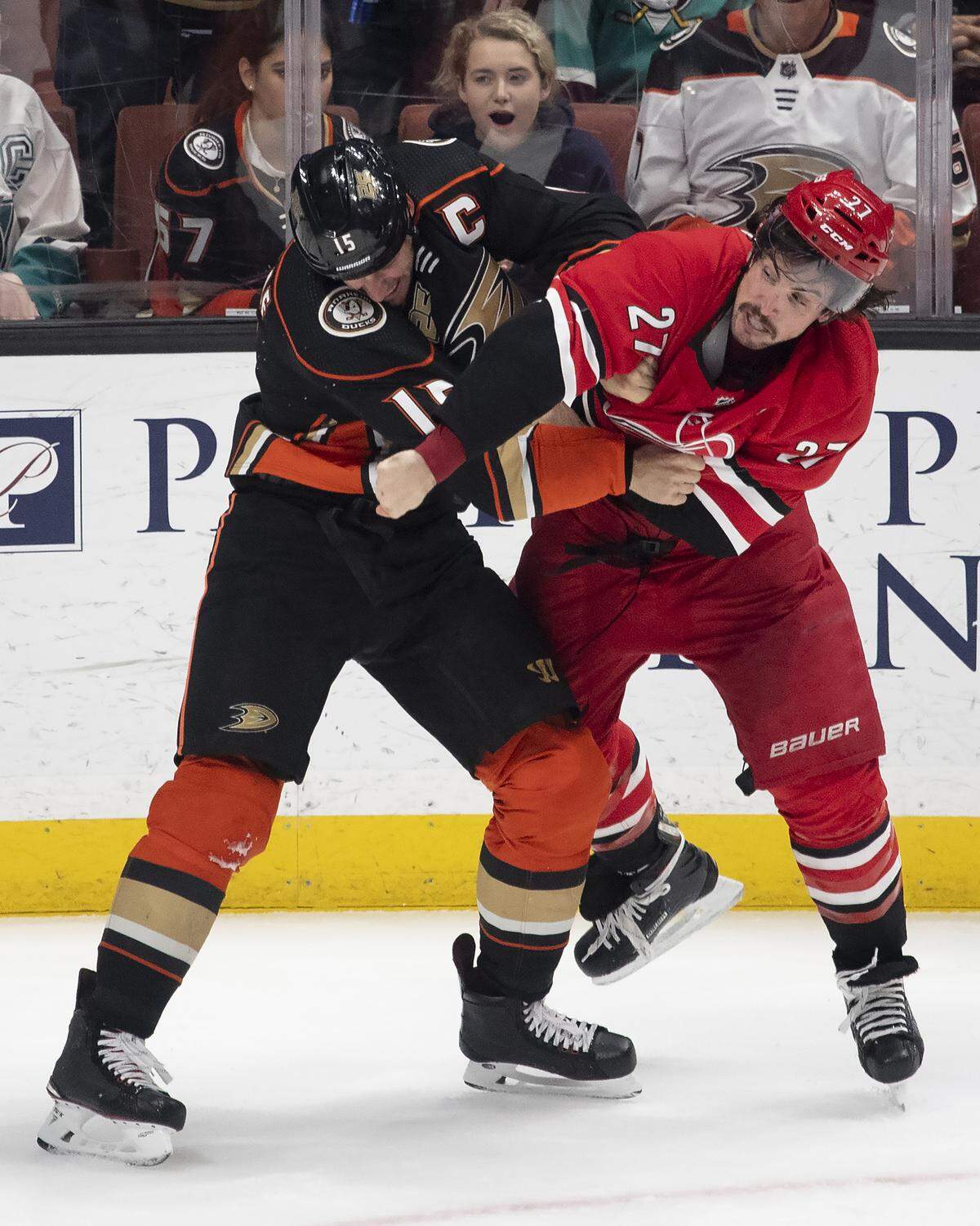Carolina Hurricanes defenseman Justin Faulk, right, and Anaheim Ducks center Ryan Getzlaf fight during the third period of an NHL hockey game in Anaheim, Calif., Friday, Dec. 7, 2018. (AP Photo/Kyusung Gong)