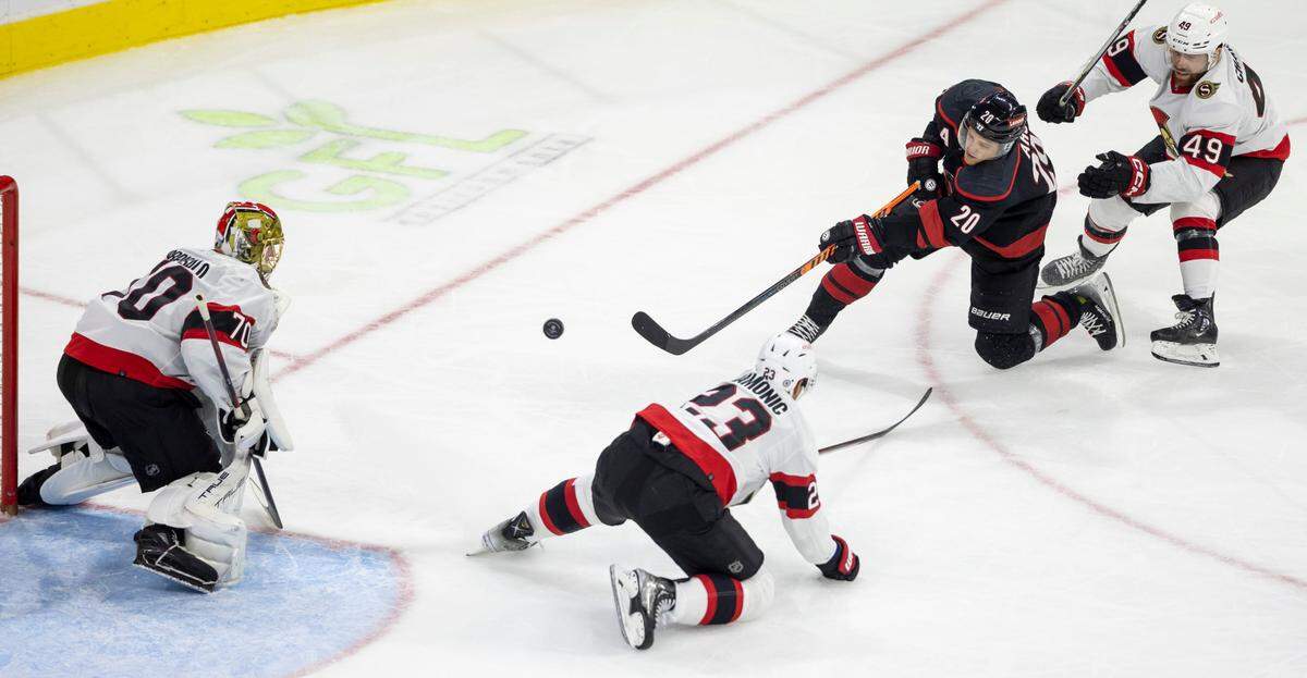 The Carolina Hurricanes Sebastian Aho (20) shoots on the Ottawa Senators goalie Joonas Korpisalo (70) in the third period on Wednesday, October 11, 2023 at PNC Arena, in Raleigh N.C.