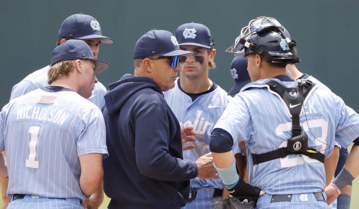 North Carolina coach Scott Forbes talks with players during a pitching change during Georgia Tech’s 5-2 victory over UNC at Boshamer Stadium in Chapel Hill, N.C., Sunday, April 19, 2026.