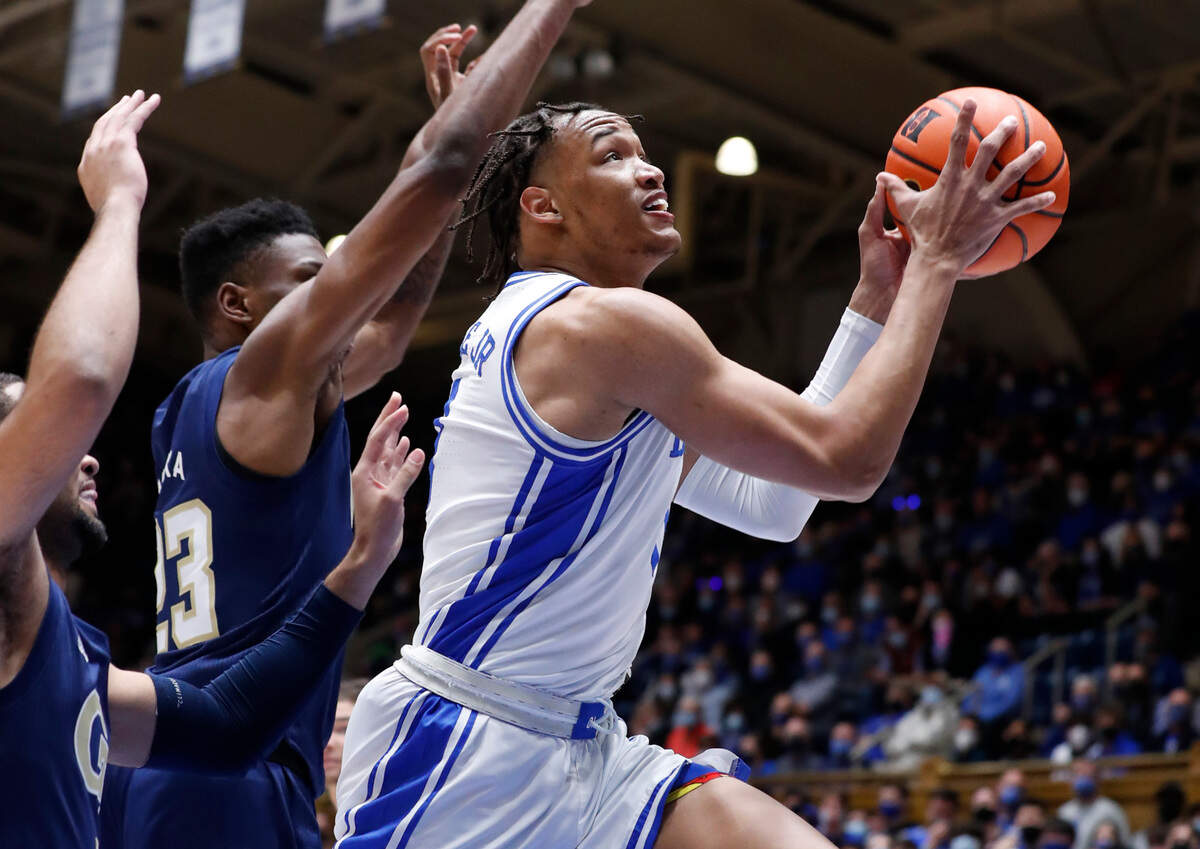 Duke’s Wendell Moore Jr. (0) drives to the basket past Georgia Tech’s Jordan Meka (23) during the first half of Duke’s game against Georgia Tech at Cameron Indoor Stadium in Durham, N.C., Tuesday, January 4, 2022.