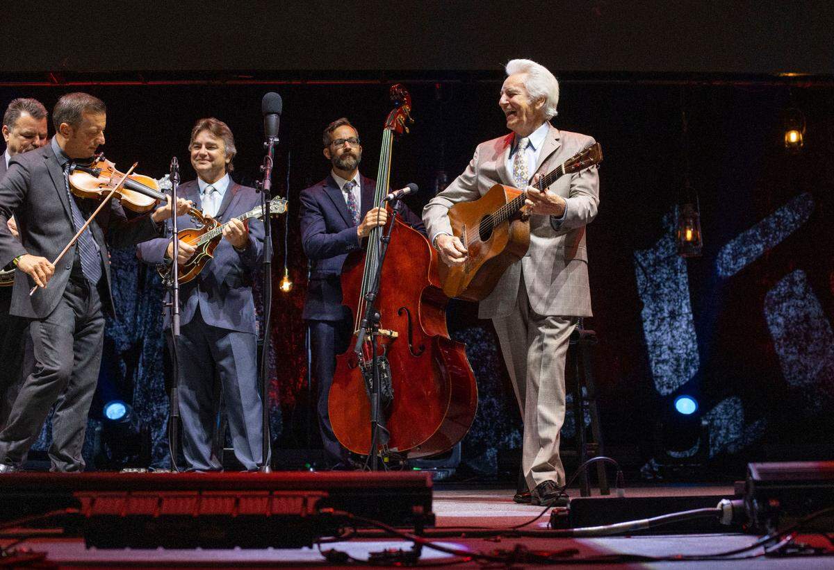 Del McCoury smiles as he introduces his band during the IBMA Bluegrass Live at Red Hat Amphitheater on Friday, October 1, 2021 in Raleigh, N.C.