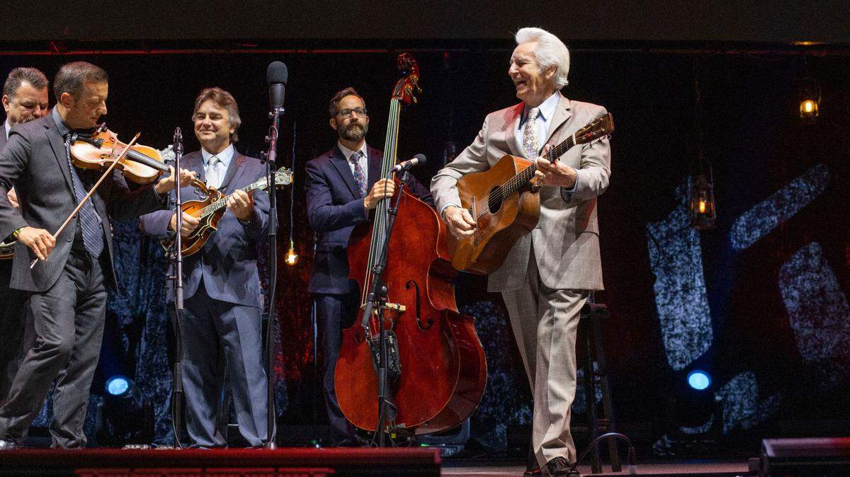 Del McCoury smiles as he introduces his band during the IBMA Bluegrass Live at Red Hat Amphitheater on Friday, October 1, 2021 in Raleigh, N.C.