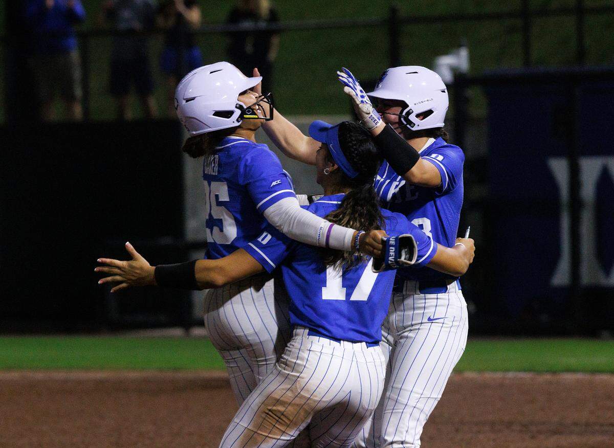 Duke’s Jada Baker, Aminah Vega and Francesca Frelick celebrate after Baker’s sacrifice bunt allowed Frelick to score a walk-off run to cement the Blue Devils’ 1-0 victory over Virginia in 12 innings on Friday, April 19, 2024, in Durham, N.C.