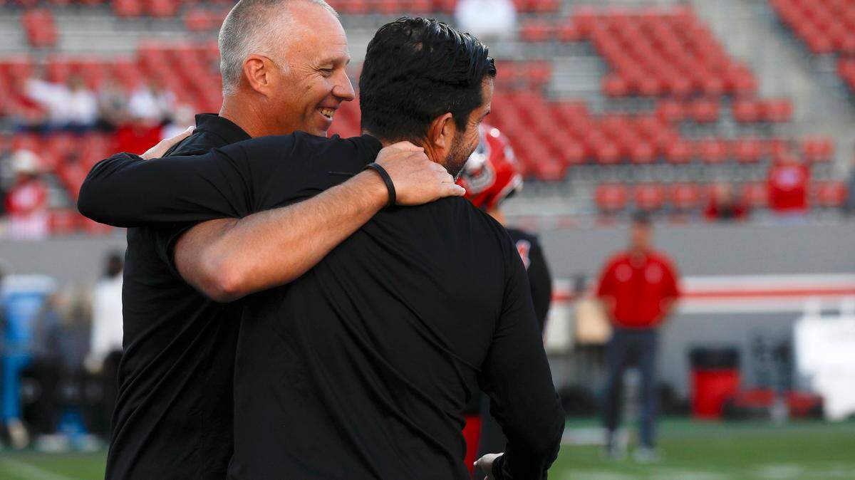 N.C. State head coach Dave Doeren greets Duke head coach Manny Diaz prior to the Blue Devils’ game against N.C. State on Saturday, Nov. 9, 2024, at Carter-Finley Stadium in Raleigh, N.C.