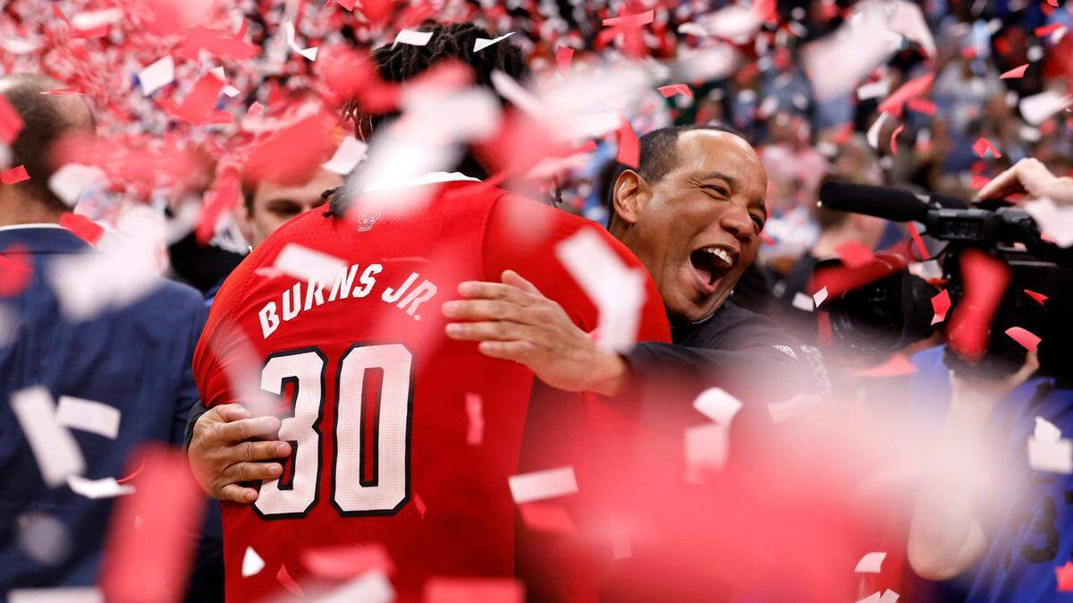 N.C. State’s head coach Kevin Keatts hugs DJ Burns Jr. (30) after N.C. State’s 84-76 victory over UNC in the championship game of the 2024 ACC Men’s Basketball Tournament at Capital One Arena in Washington, D.C., Saturday, March 16, 2024.