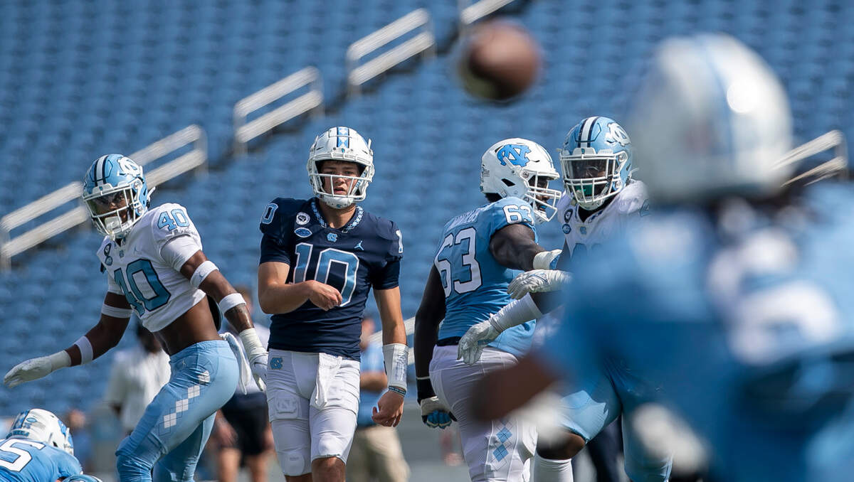 North Carolina quarterback Drake Maye (10) passes to wide receiver Nate McCollum (6) for a touchdown during the Tar Heels’ spring football game on Saturday, April 15, 2023 at Kenan Stadium in Chapel Hill, N.C