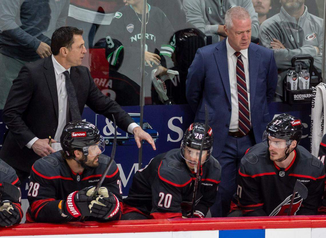 Carolina Hurricanes coach Rod Brind’Amour, far left, speaks to right wing Andrei Svechnikov (37) in the second period against the Washington Capitols during Game 3 on May 10, 2025, at Lenovo Center in Raleigh.
