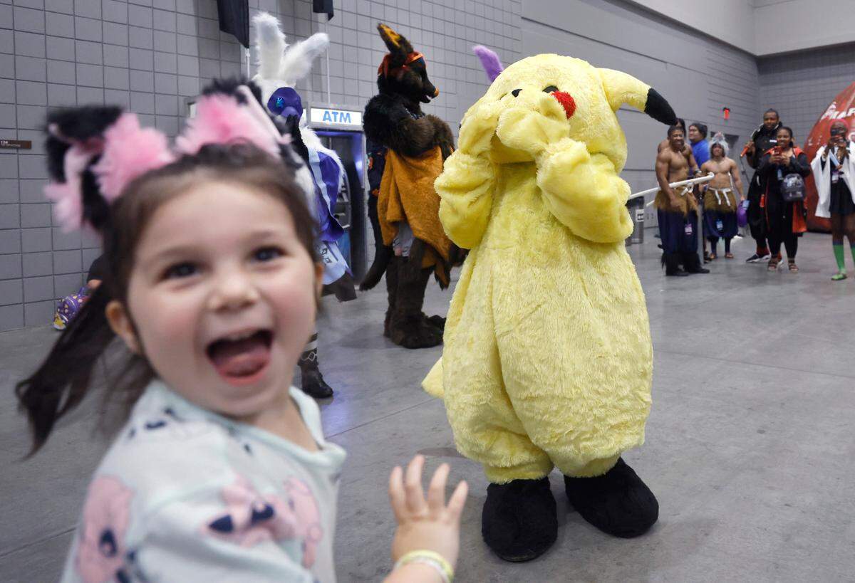 Violet Woodard, 4, reacts after seeing Pikachu during GalaxyCon Raleigh at the Raleigh Convention Center Friday, July 28, 2023.