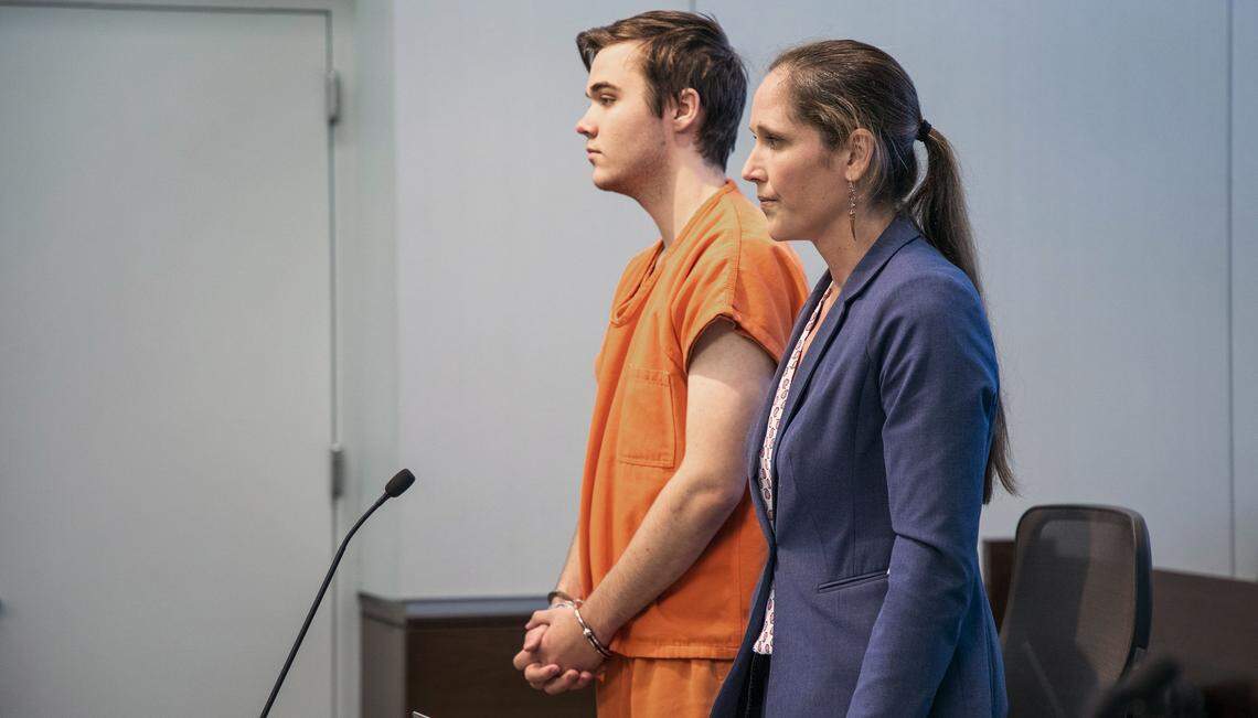Durham lawyer Allyn Sharp stands with her client Alexander Bishop, 16, charged with first degree murder and accused of killing his father who was found unresponsive last April with a dog leash around his neck, during his first appearance where Judge Orlando Hudson set a $250,000 unsecured bond, on Monday, Feb. 25, 2019, in Durham, NC.
