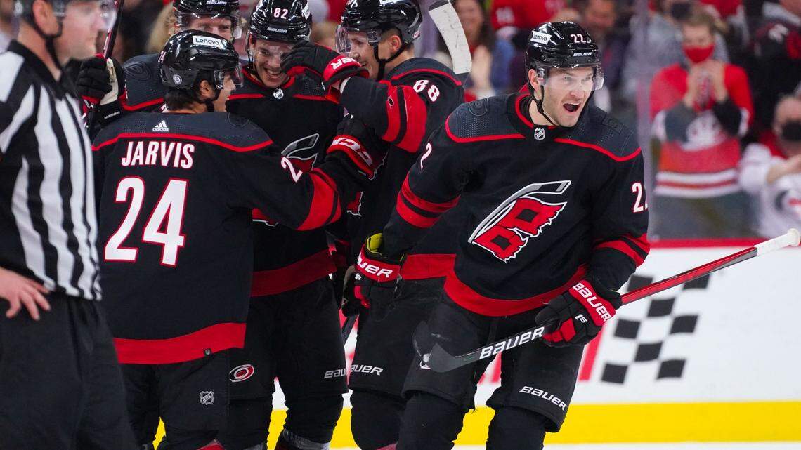 Oct 31, 2021; Raleigh, North Carolina, USA; Carolina Hurricanes defenseman Brett Pesce (22) celebrates his third period goal with center Seth Jarvis (24) Carolina Hurricanes center Martin Necas (88) center Jesperi Kotkaniemi (82) and center Jordan Staal (11) against the Arizona Coyotes at PNC Arena. Mandatory Credit: James Guillory-USA TODAY Sports