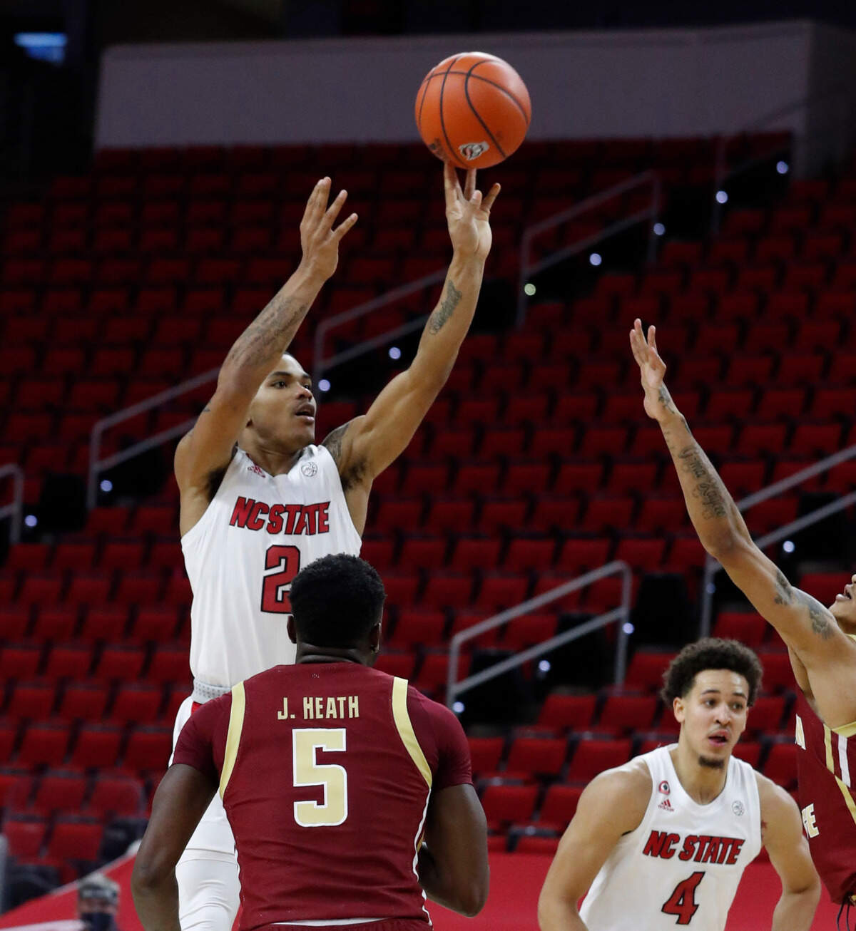 N.C. State’s Shakeel Moore (2) makes the jumper with 26 seconds left in the game to give the Wolfpack the lead during the second half of N.C. State’s 79-76 victory over Boston College at PNC Arena in Raleigh, N.C., Wednesday, December 30, 2020.