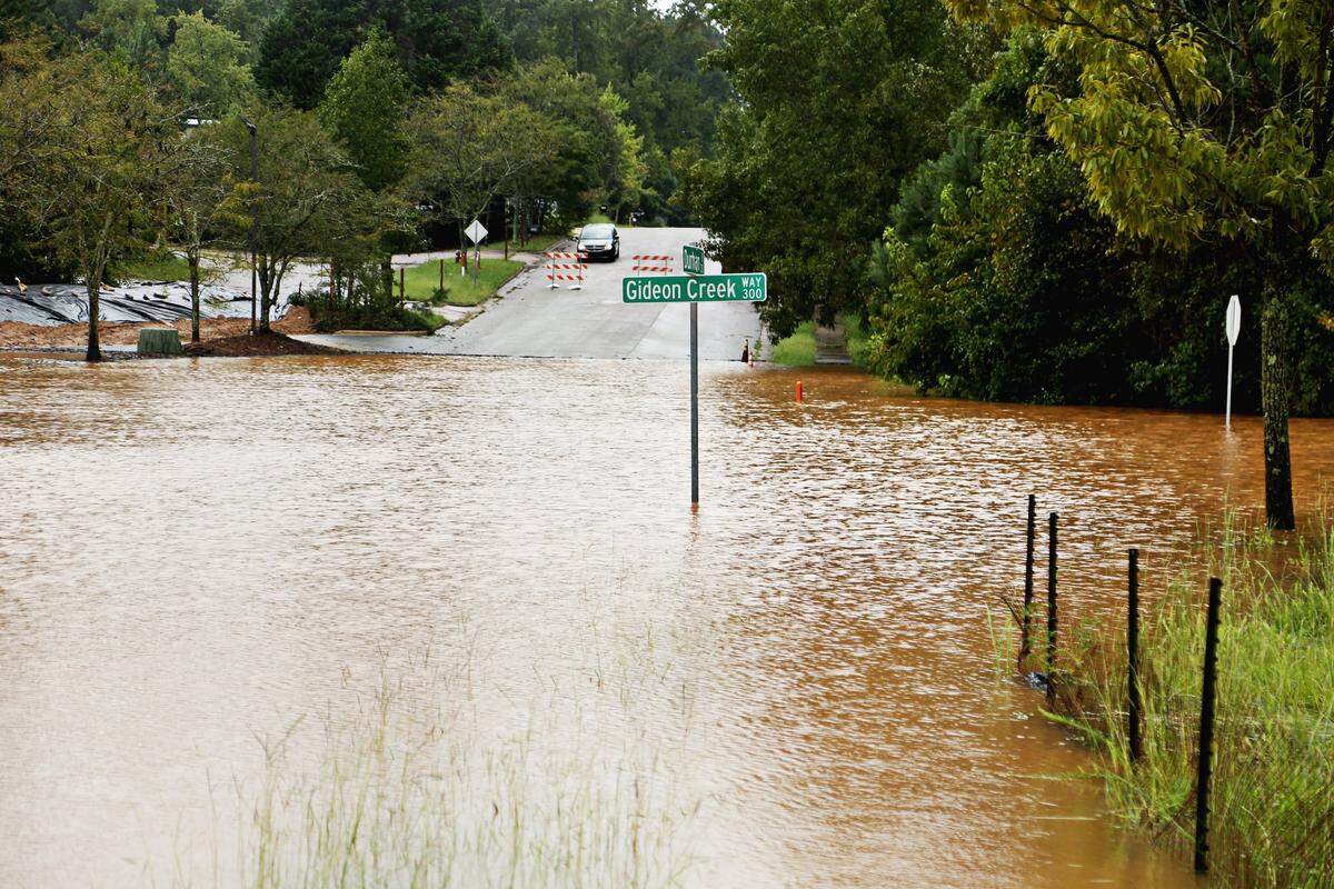 Durham Dr. and Gideon Creek Way in Garner were already flooded and roadblocks were put up on Saturday afternoon, Sept. 15, 2018.